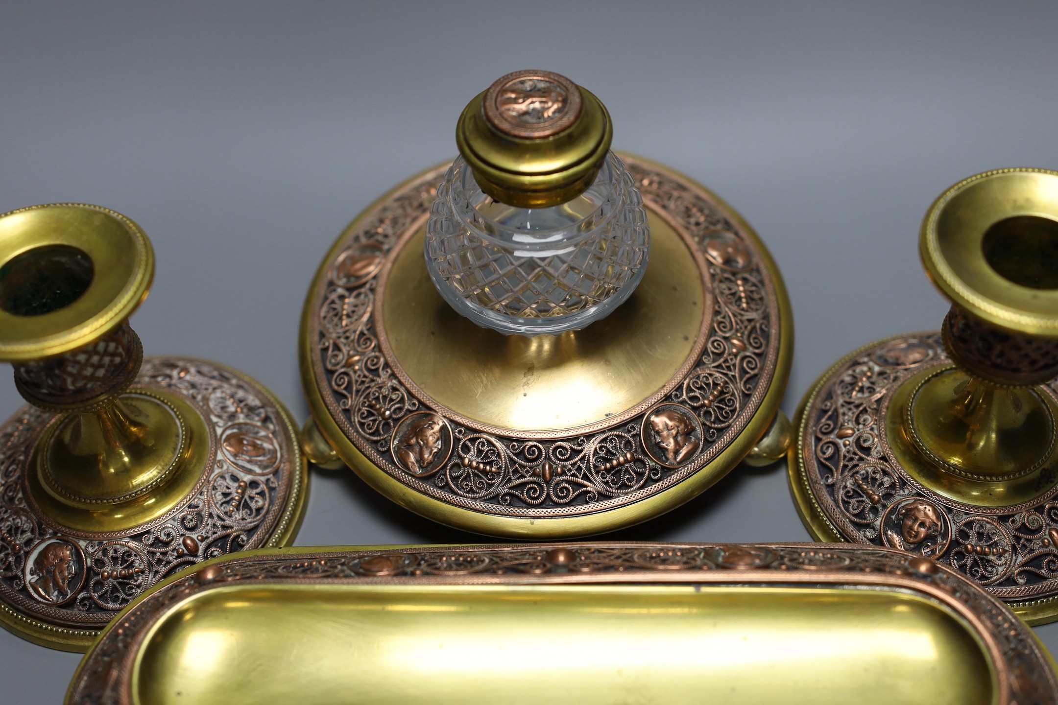 A 19th century brass and copper filigree desk set, 23cm